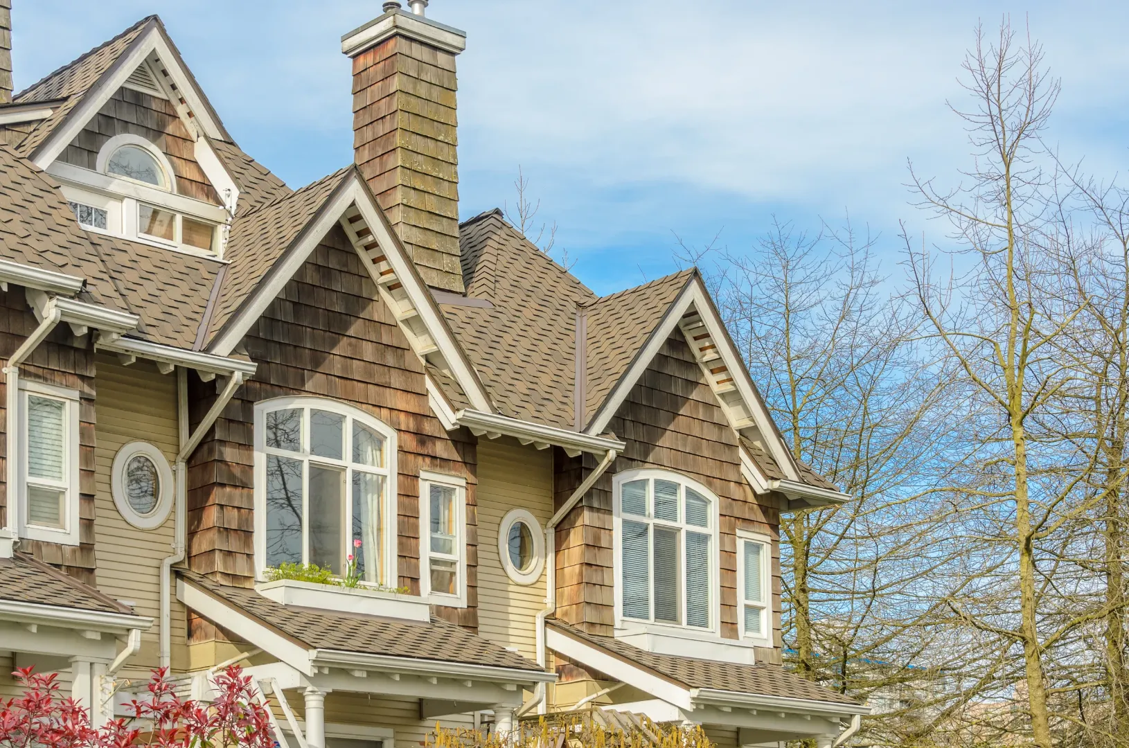 House with siding exterior showing the benefits of updating a brick home