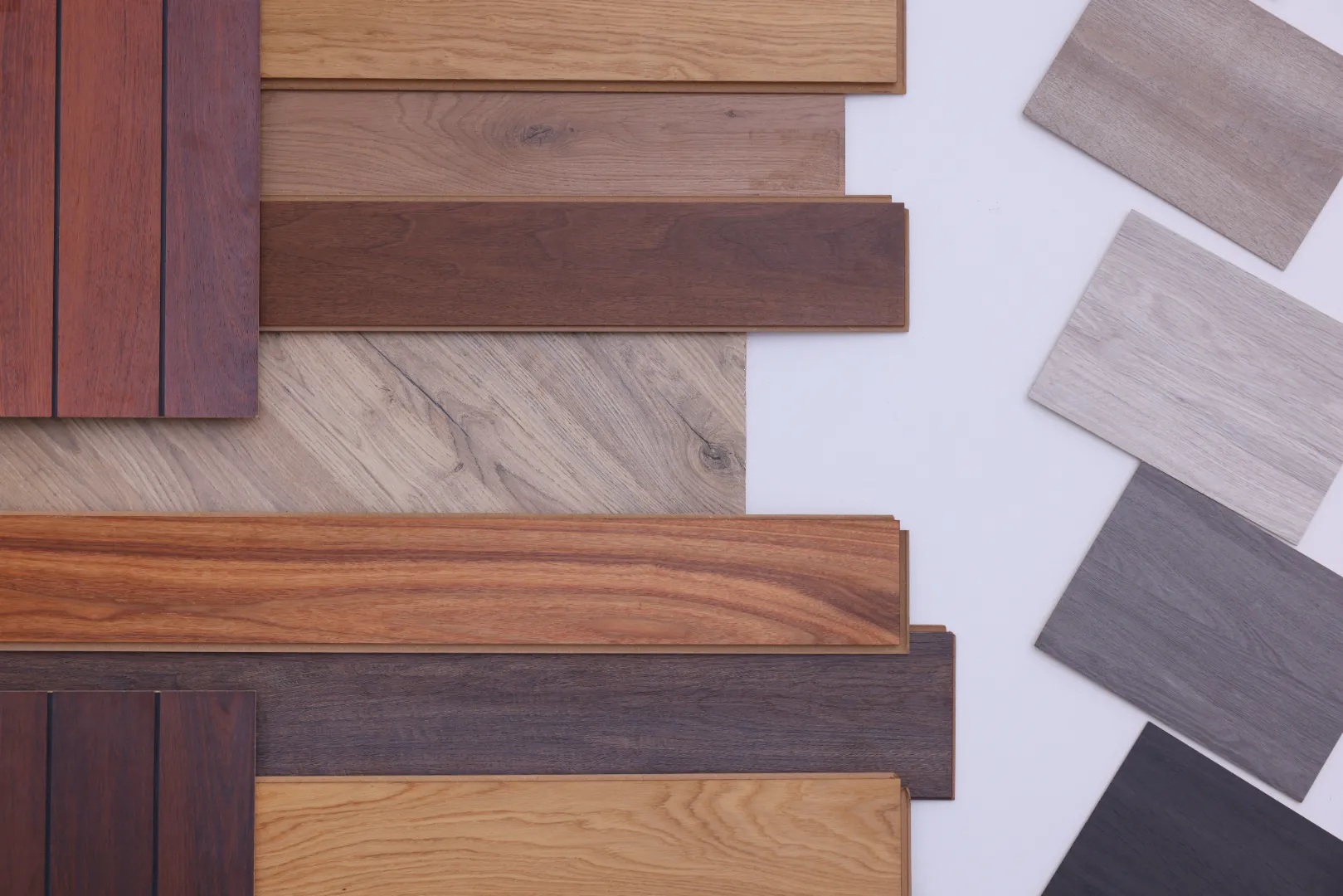 Composite decking boards in different colors and wood grain finishes