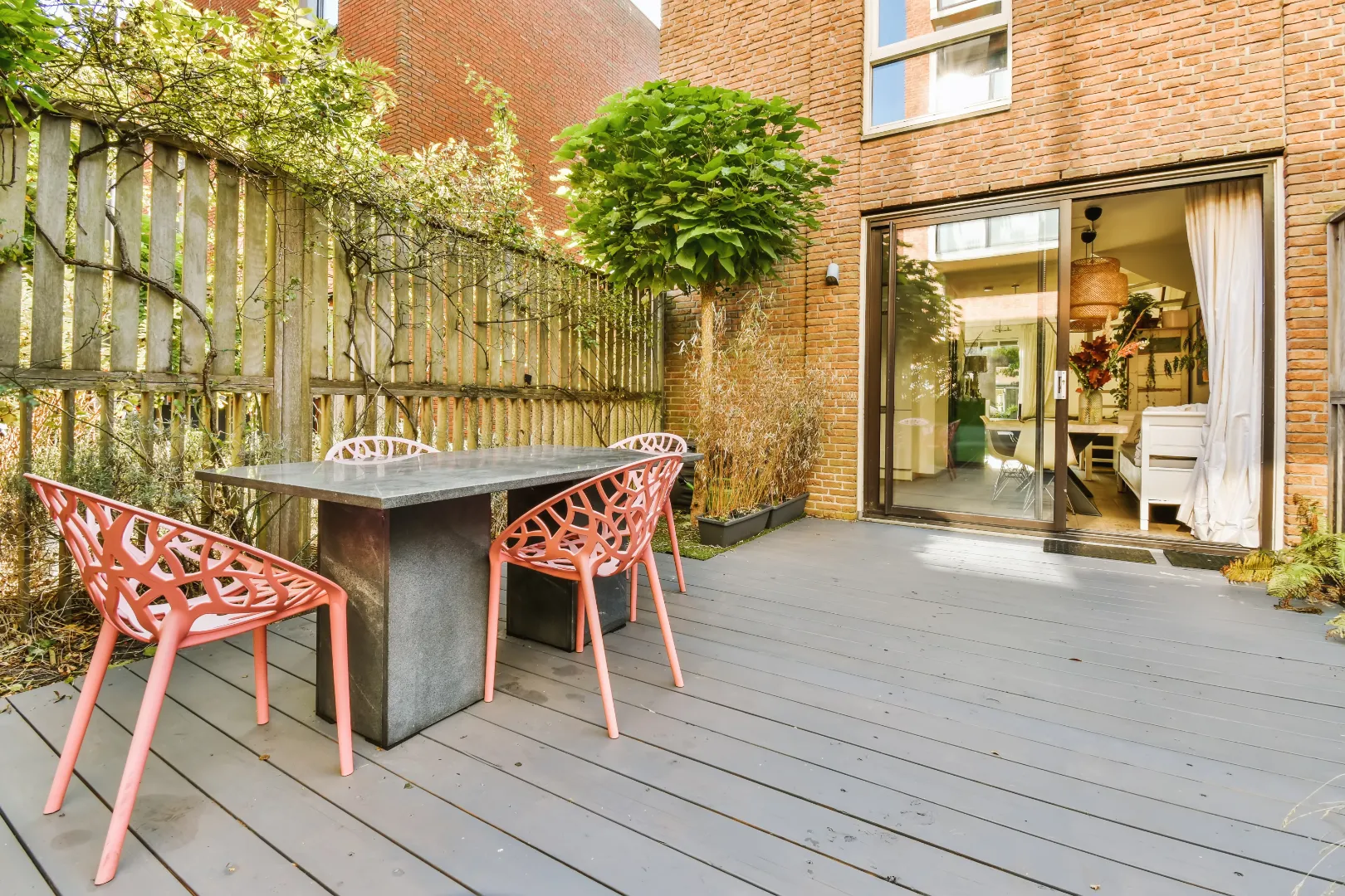 Light gray composite decking on a sunny outdoor patio
