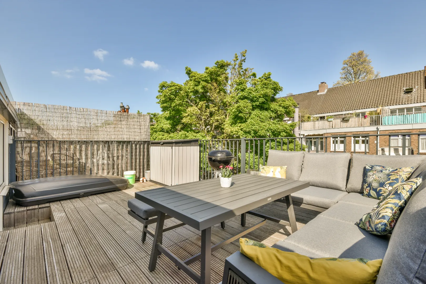 Composite deck with outdoor furniture in a backyard.