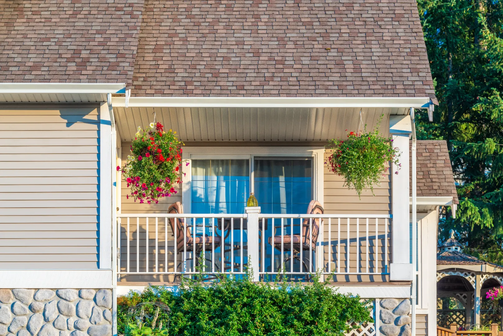 Beige vinyl siding on a residential home designed to resemble traditional wood siding.