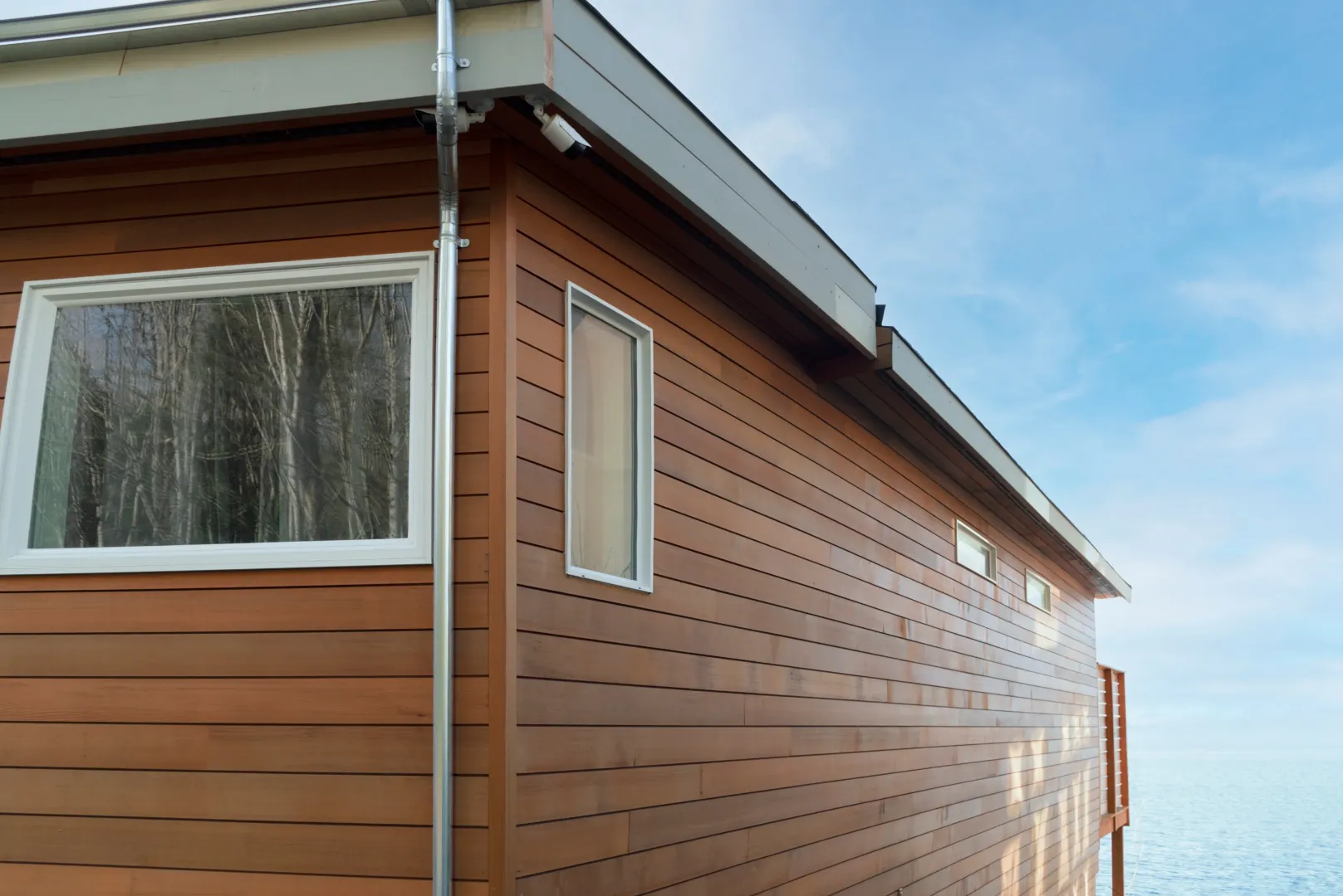 Wood siding on a house exterior with horizontal natural wood boards